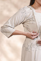 Off White floral printed A-line maternity wear with 3/4 sleeves and keyhole neck