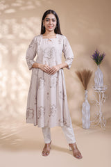 Beige floral printed A-line maternity wear with 3/4 sleeves and keyhole neck