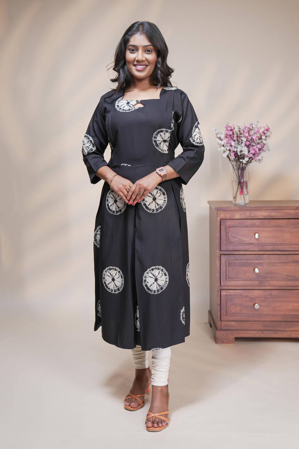 Black circular motifs box pleat maternity wear with 3/4 sleeves and box neck