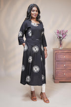 Black circular motifs box pleat maternity wear with 3/4 sleeves and box neck