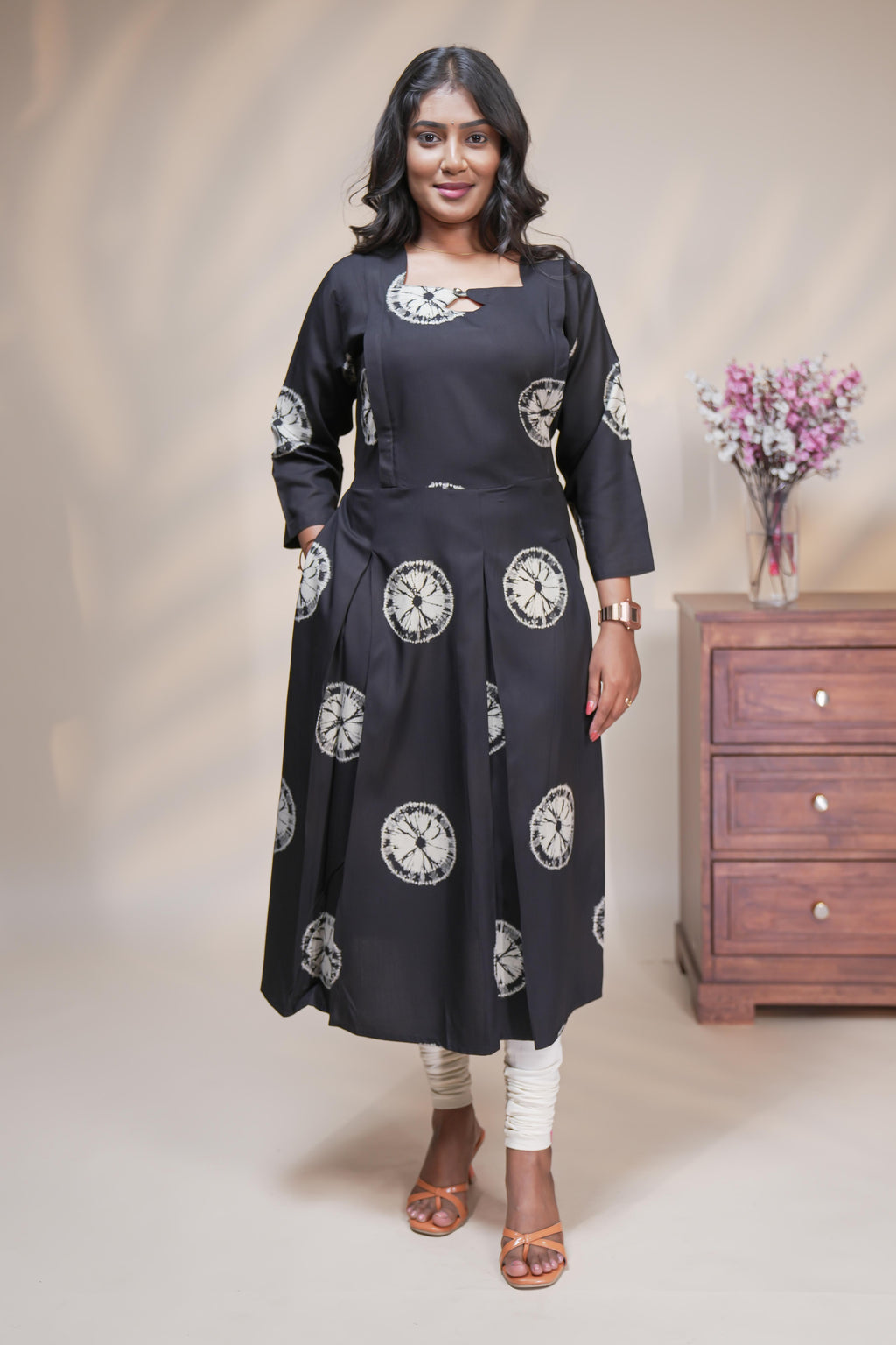 Black circular motifs box pleat maternity wear with 3/4 sleeves and box neck