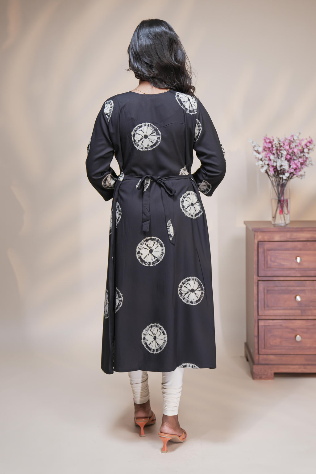 Black circular motifs box pleat maternity wear with 3/4 sleeves and box neck