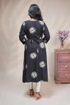 Black circular motifs box pleat maternity wear with 3/4 sleeves and box neck
