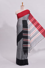 Grey plain narayanapet cotton saree with contrast border and striped blouse
