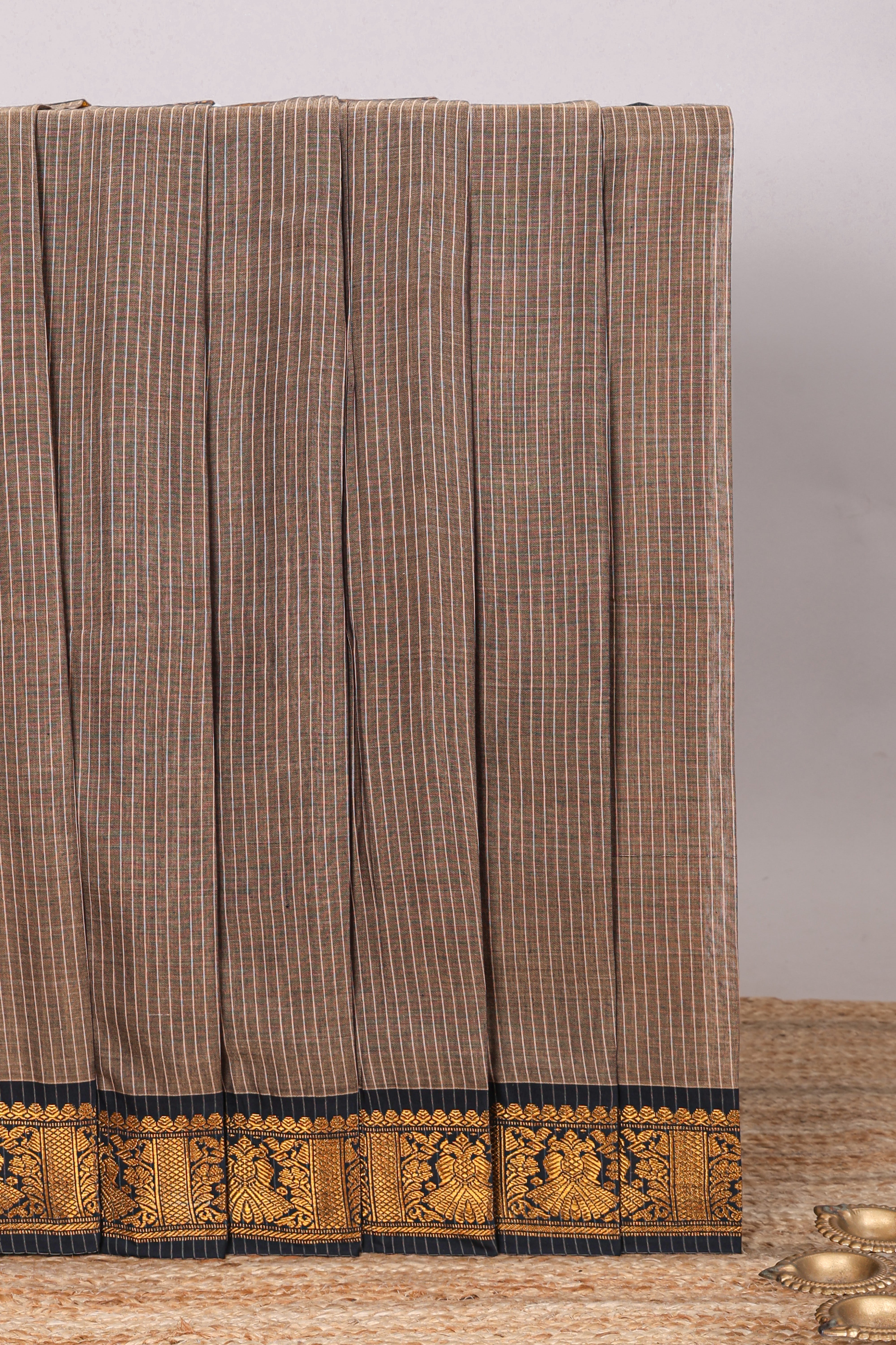 Earthy brown plain narayanapet cotton saree with contrast zari weave border and matching blouse