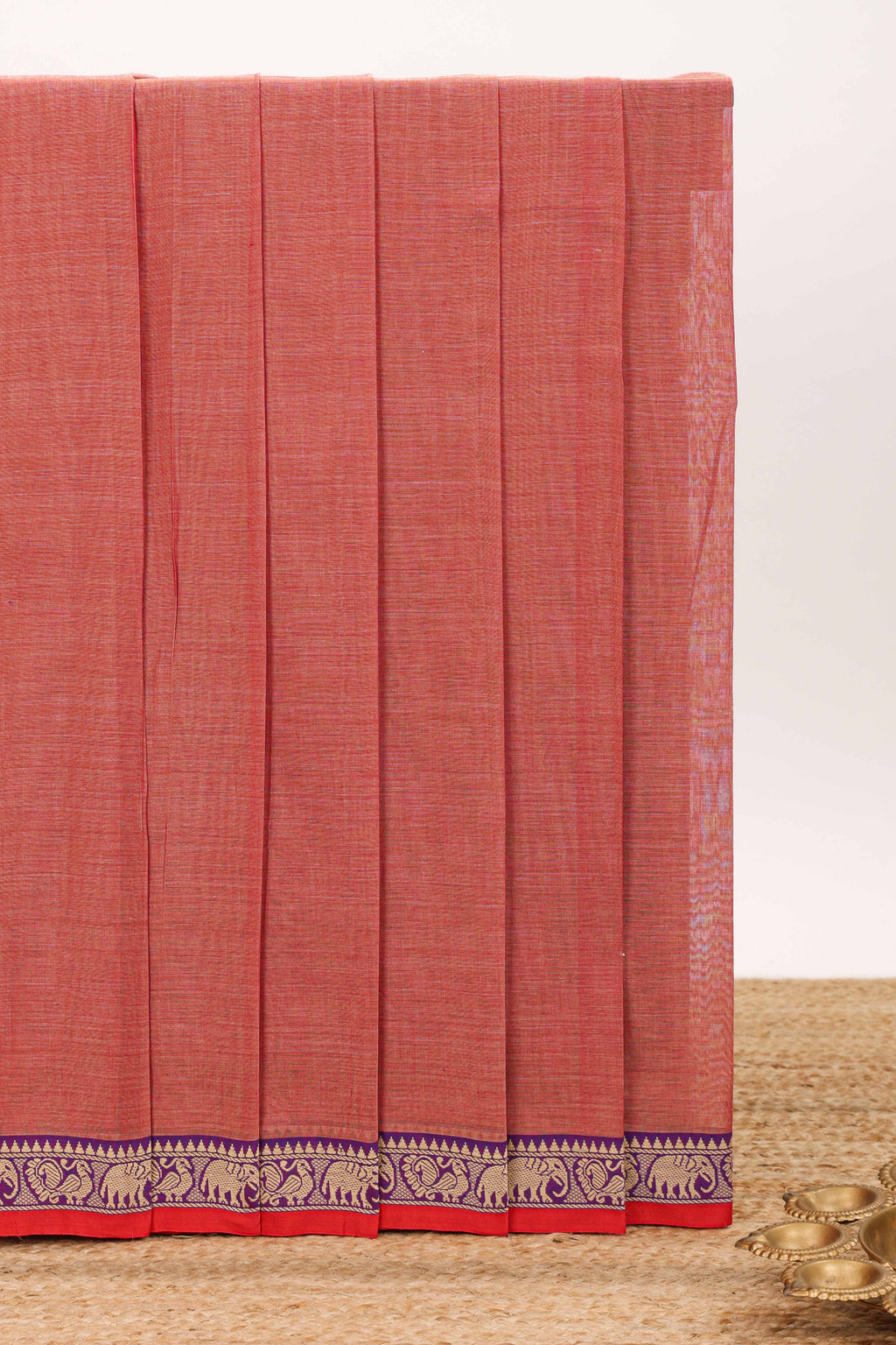Peach plain narayanapet cotton saree with contrast elephant motifs border and matching pallu