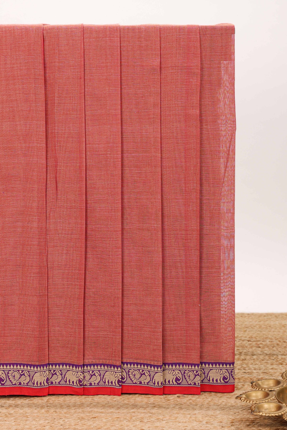Peach plain narayanapet cotton saree with contrast elephant motifs border and matching pallu