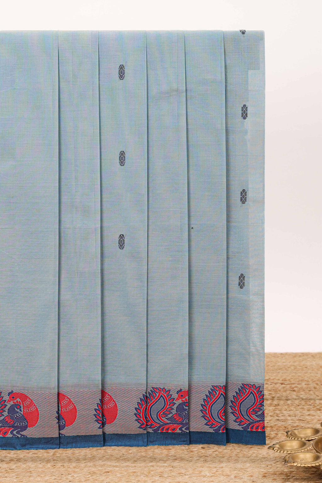 Light blue Butta designed narayanapet cotton saree with contrast peacock motifs border and matching pallu