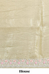 Pastel yellow organza saree featuring delicate floral embroidery intricate lace detailing on the border and pallu with a scalloped finishing along with matching blouse