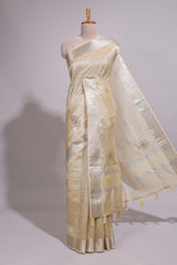 Cream organza saree featuring delicate floral embroidery intricate with silverborder along with blouse