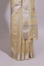 Cream organza saree featuring delicate floral embroidery intricate with silver  border along with blouse
