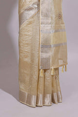 Cream organza saree featuring delicate floral embroidery intricate with silverborder along with blouse