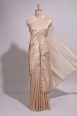 Ivory beige organza saree with plain body border and pallu with a scalloped finishing along with matching blouse
