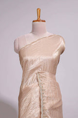 Ivory beige organza saree with plain body border and pallu with a scalloped finishing along with matching blouse