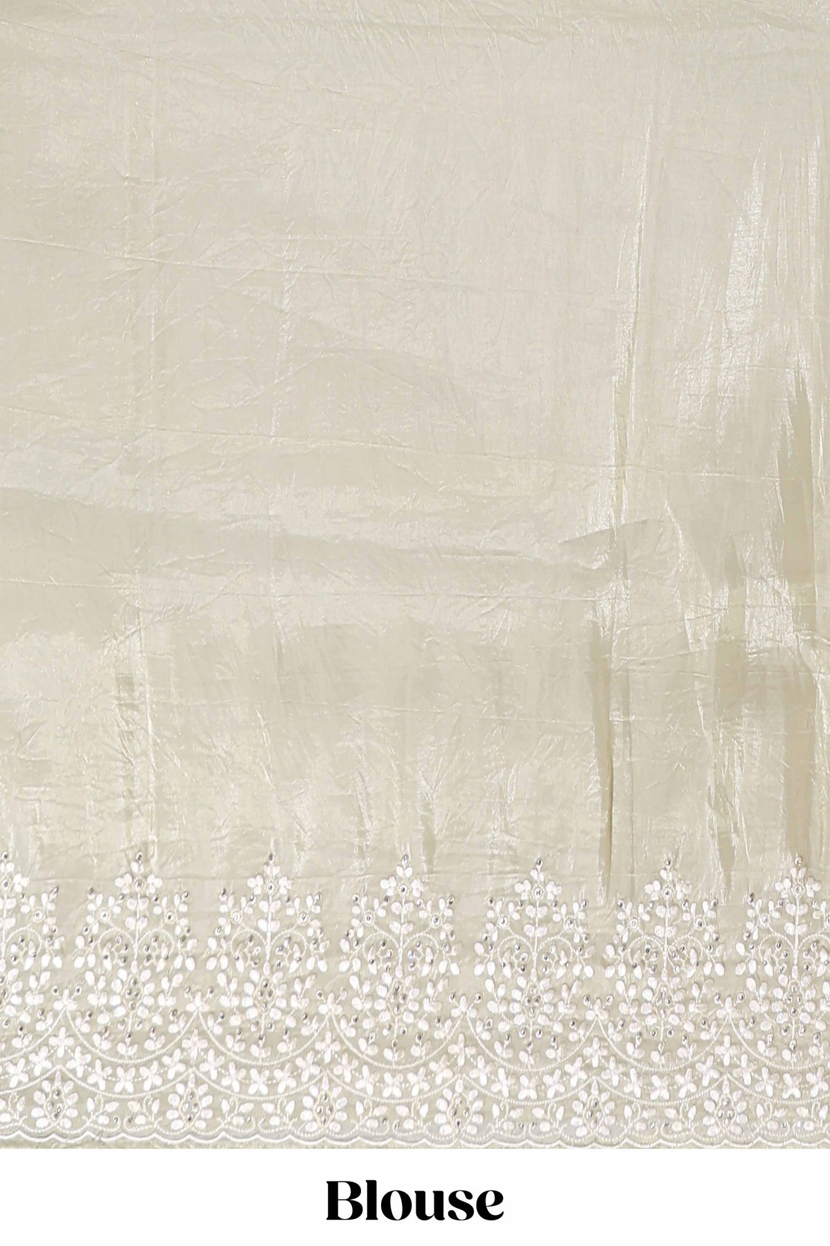 Pastel ivory organza saree with delicate floral embroidery intricate lace border and scalloped pallu detailing