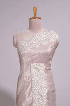 Soft blush pink organza saree with delicate floral embroidery intricate lace border and scalloped pallu detailing