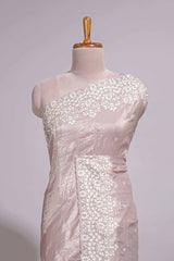 Soft blush pink organza saree with delicate floral embroidery intricate lace border and scalloped pallu detailing