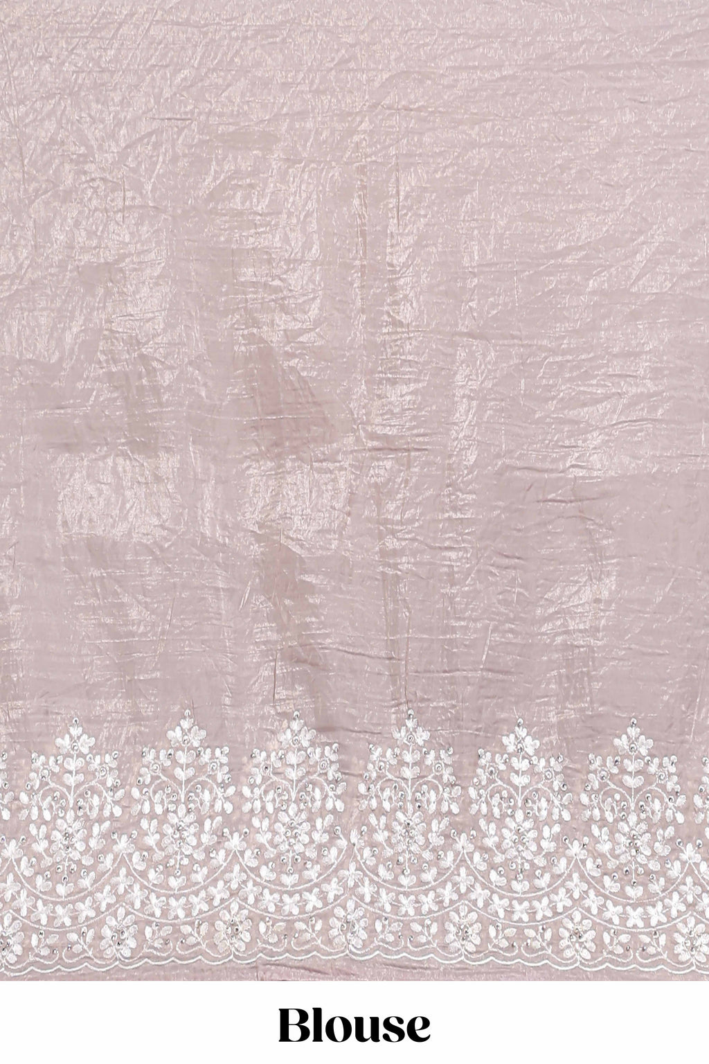 Soft blush pink organza saree with delicate floral embroidery intricate lace border and scalloped pallu detailing