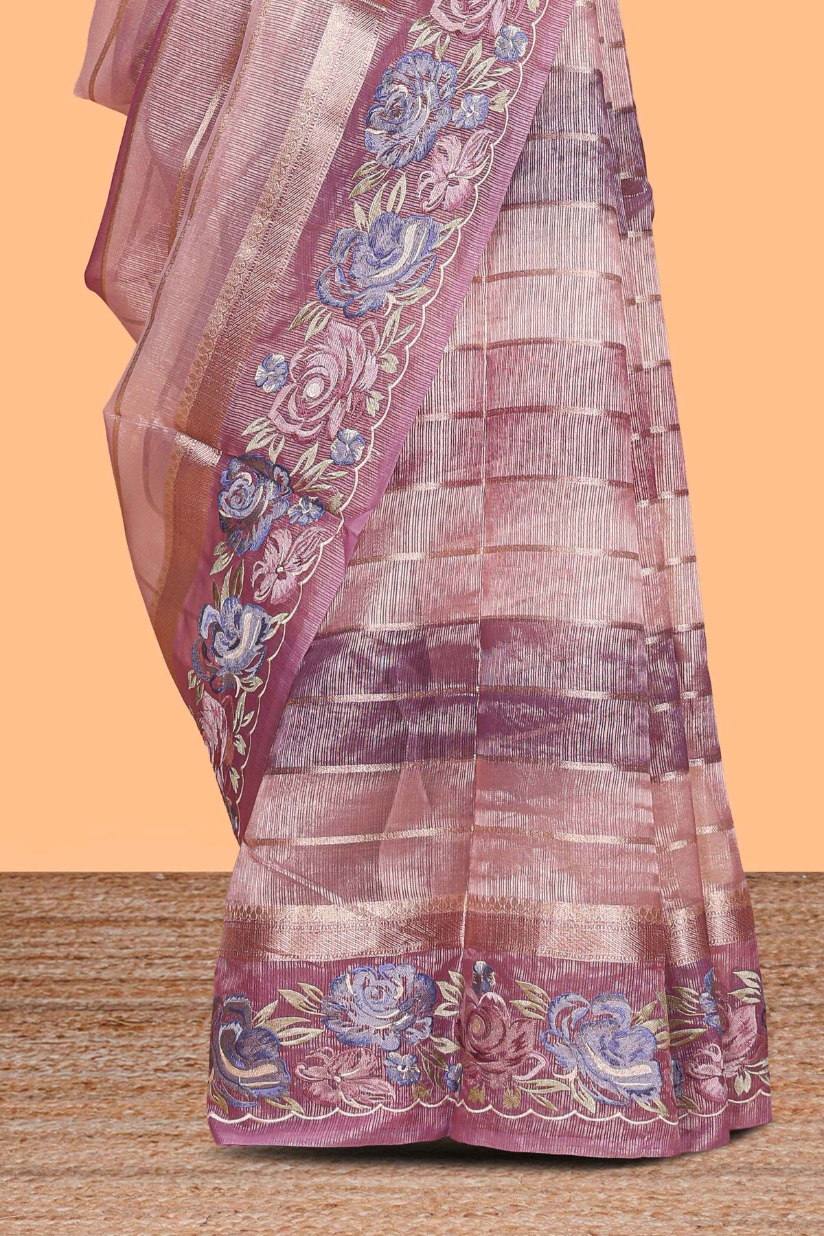 Peach striped design organza saree with floral design border and matching plain blouse