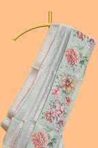 Green striped design organza saree with floral design border and matching floral motifs blouse