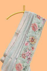Green striped design organza saree with floral design border and matching floral motifs blouse