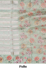 Green striped design organza saree with floral design border and matching floral motifs blouse