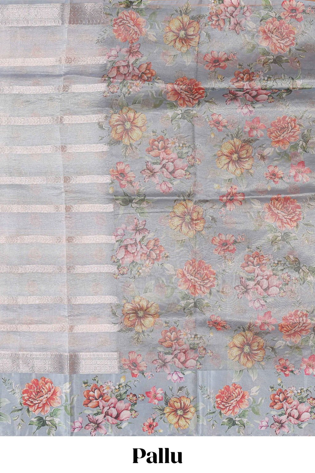 Grey shade striped design organza saree with floral design border and matching floral motifs blouse