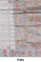 Grey shade striped design organza saree with floral design border and matching floral motifs blouse