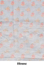 Grey shade striped design organza saree with floral design border and matching floral motifs blouse