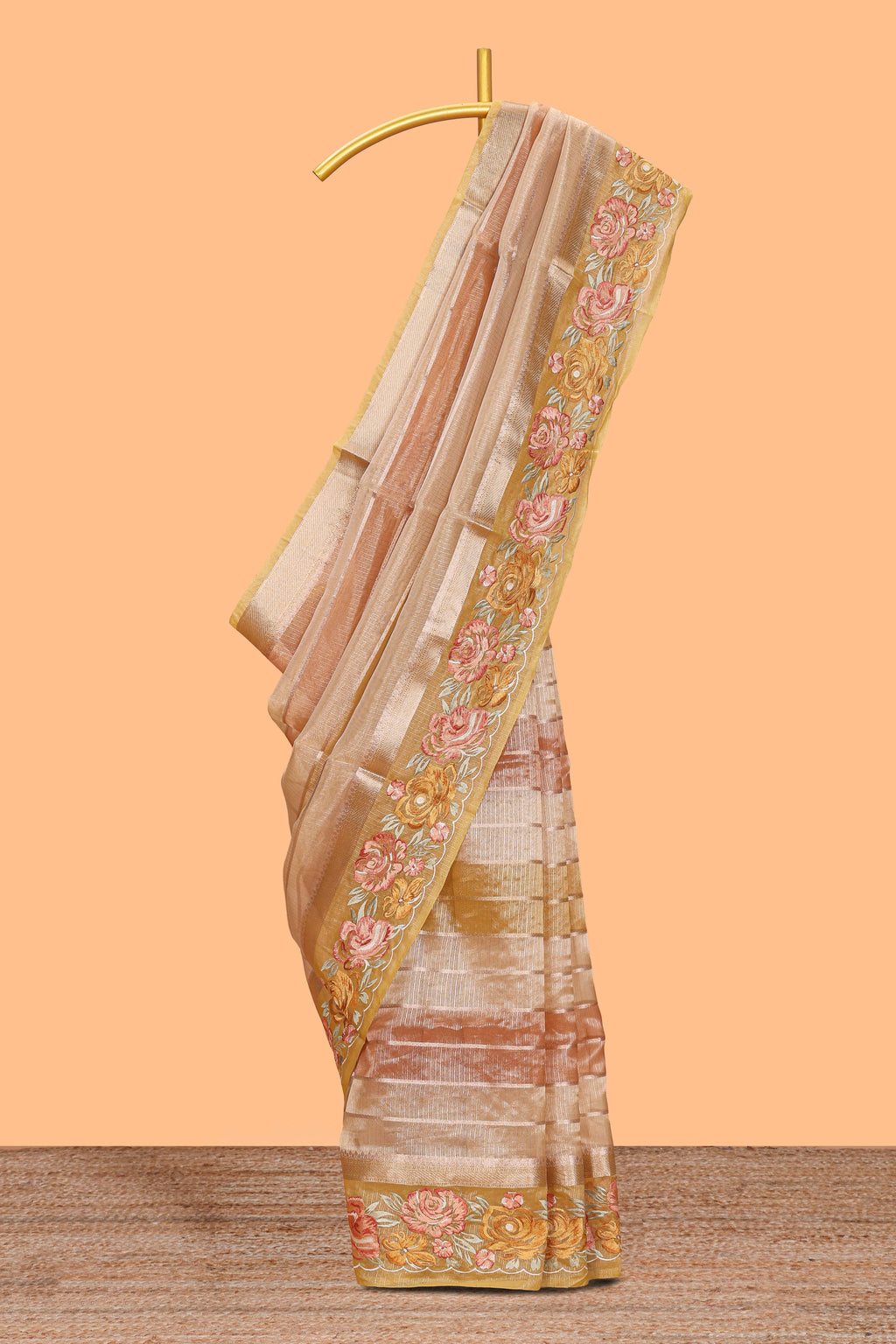 Peach gold striped art tissue saree with floral embroidered border and striped pallu