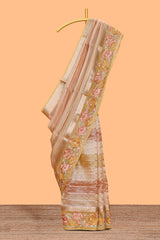 Peach gold striped art tissue saree with floral embroidered border and striped pallu
