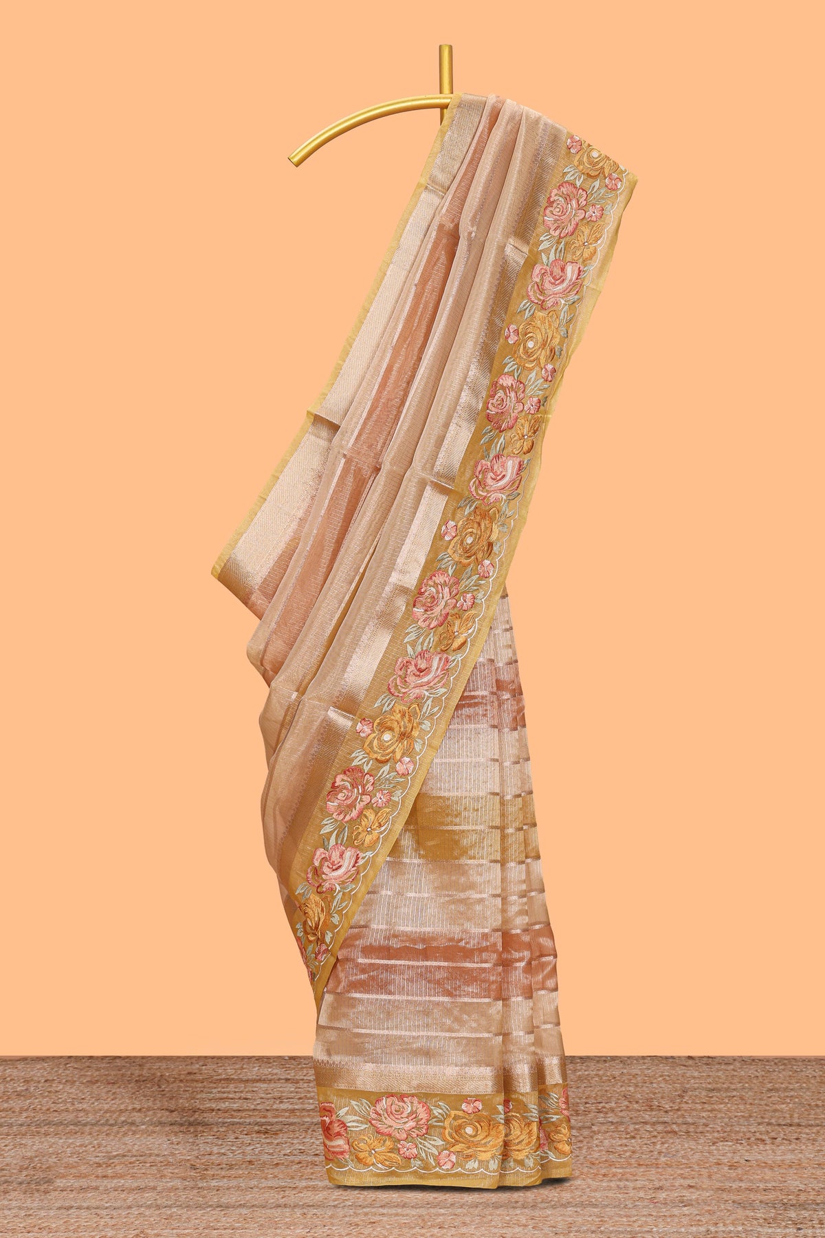 Peach gold striped art tissue saree with floral embroidered border and striped pallu