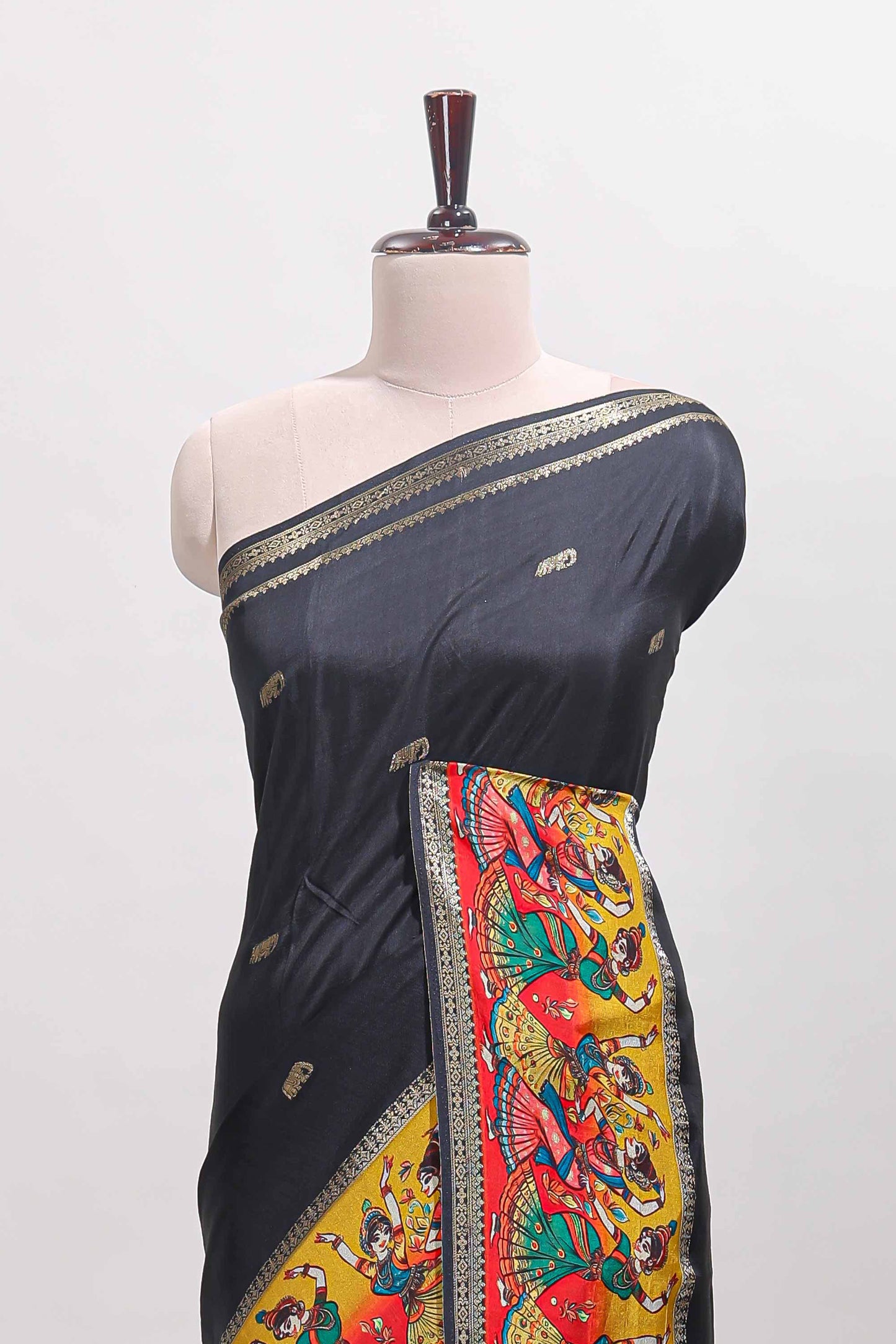 Black zari butta banarasi silk saree with contrast kalamkari style border and matching blouse