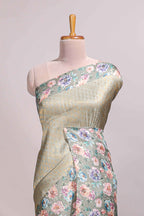 Green floral zari motifs banarasi silk saree with contrast border and printed blouse