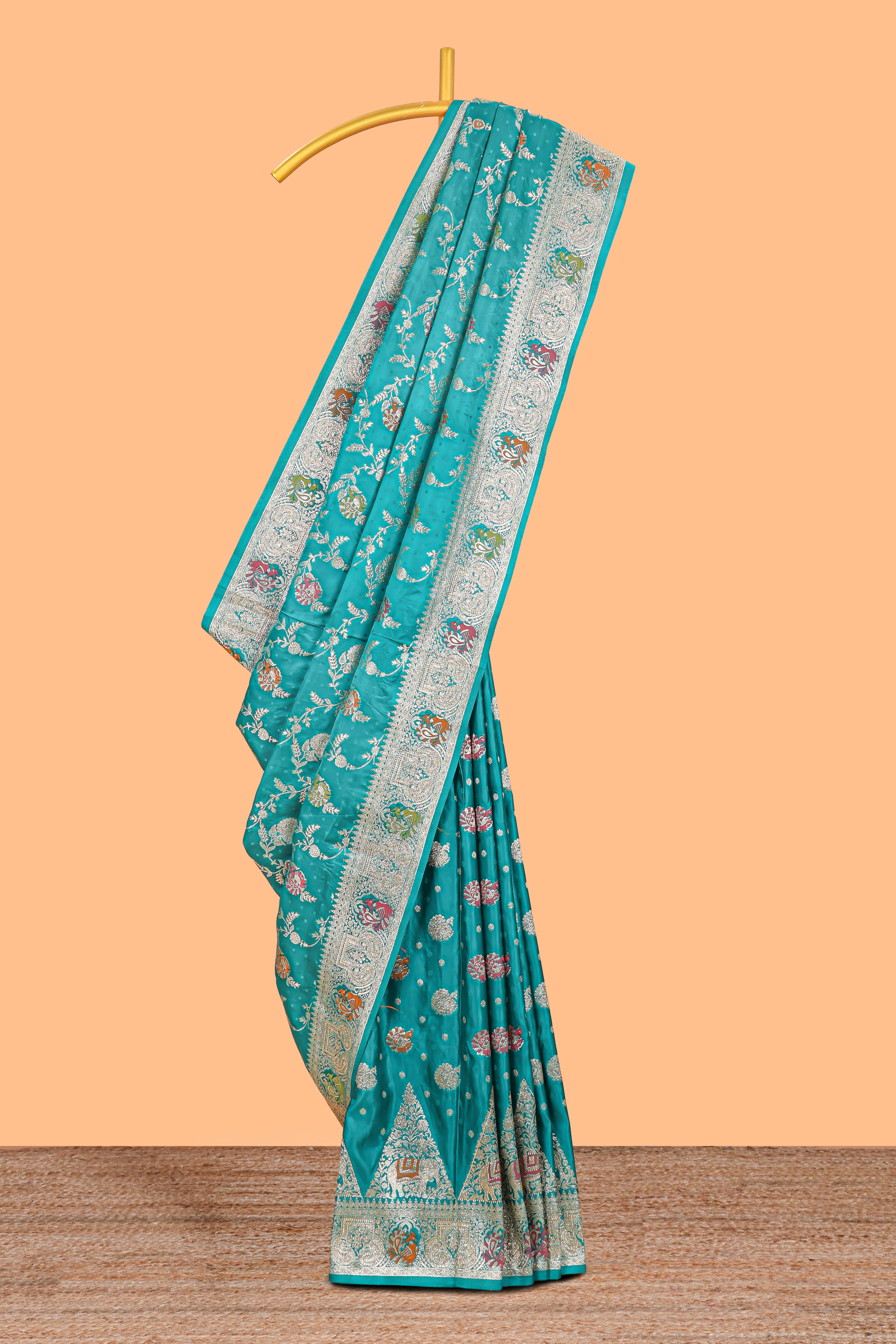 Green floral zari design banarasi silk saree with self border and matching printed blouse