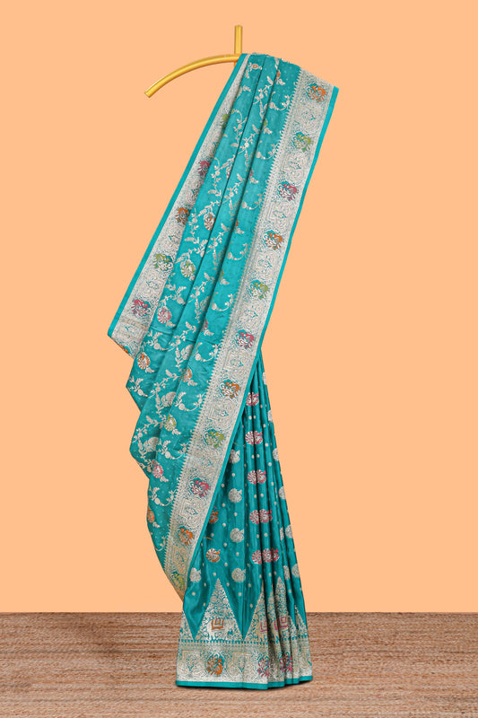 Green floral zari design banarasi silk saree with self border and matching printed blouse