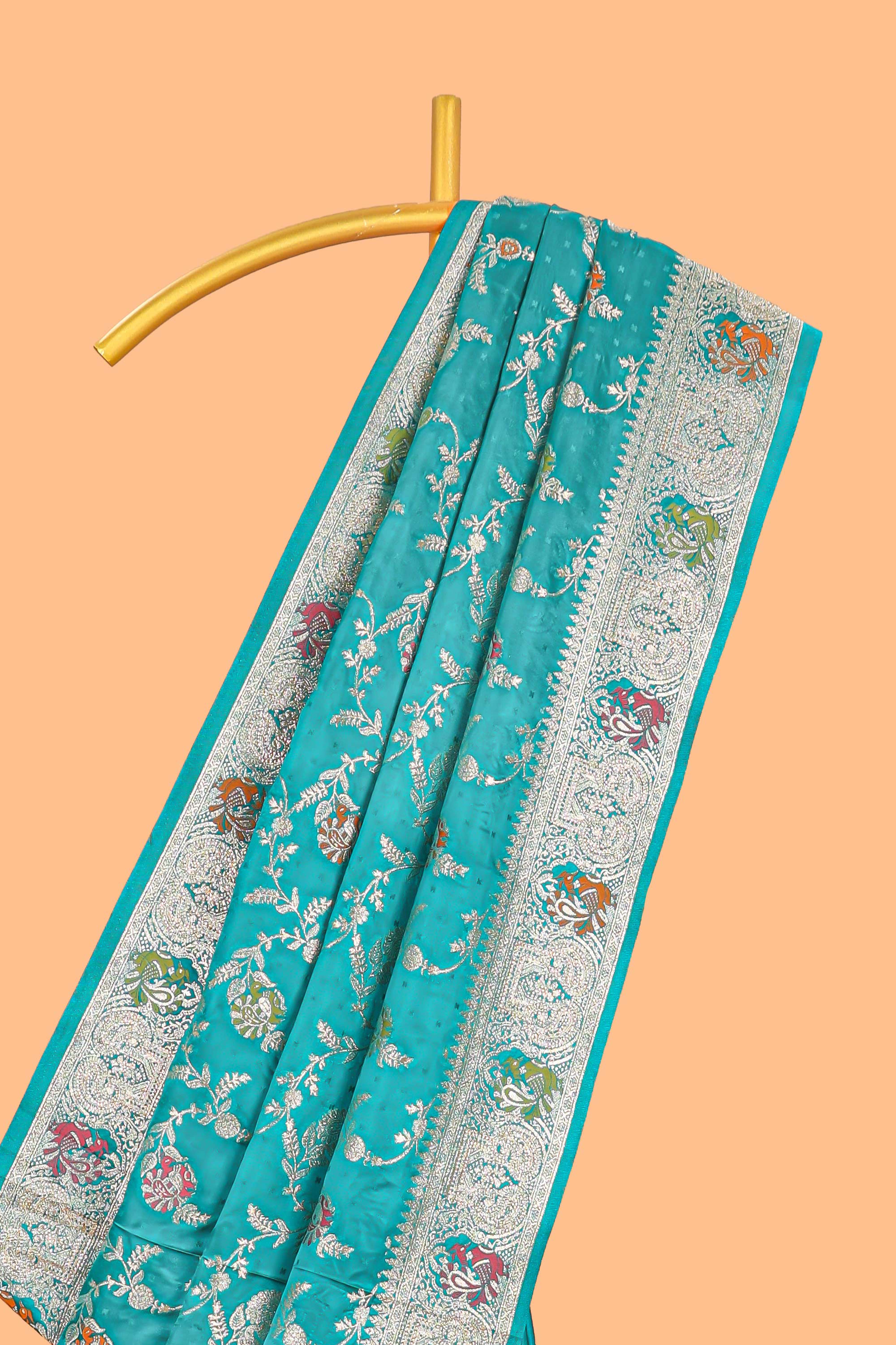 Green floral zari design banarasi silk saree with self border and matching printed blouse