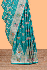 Green floral zari design banarasi silk saree with self border and matching printed blouse