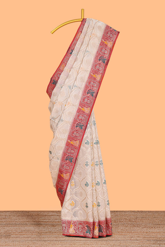 Cream floral design banarasi silk saree with contrast border and floral printed blouse
