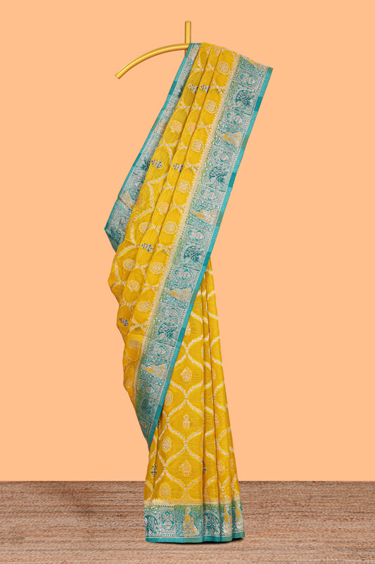 Yellow floral design banarasi silk saree with contrast border and floral printed blouse
