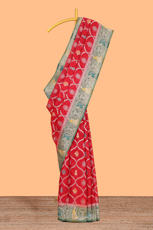 Red floral design banarasi silk saree with contrast border and floral printed blouse
