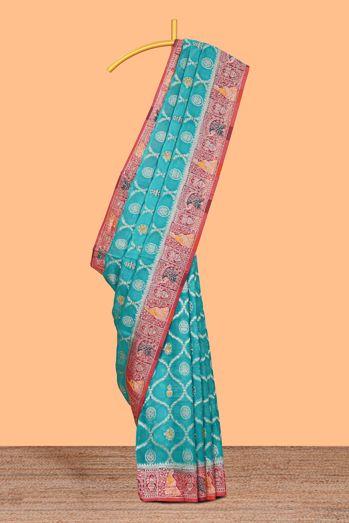 Turquoise blue floral design banarasi silk saree with contrast border and floral printed blouse
