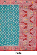 Turquoise blue floral design banarasi silk saree with contrast border and floral printed blouse