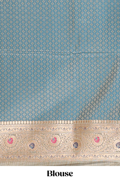 Turquoise blue floral design motifs banarasi silk saree with contrast border and floral printed blouse