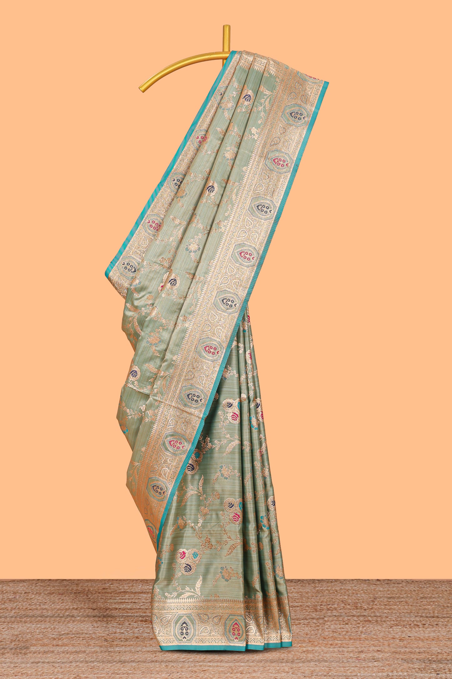 Green floral design banarasi silk saree with contrast border and floral printed blouse