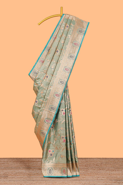 Green floral design banarasi silk saree with contrast border and floral printed blouse