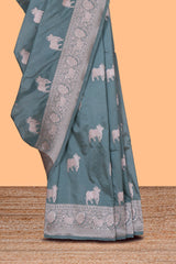 Jade green cow zari motifs design banarasi silk saree with self border and matching blouse