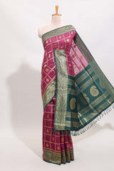 Magenta all-over checked grid pattern and butta banarasi silk saree with green contrast floral zari border and buttas blouse