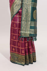 Magenta all-over checked grid pattern and butta banarasi silk saree with green contrast floral zari border and buttas blouse