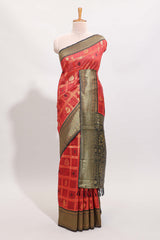 Red shade checked and butta banarasi silk saree with black contrast geometric zari border and buttas blouse